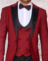 A person is dressed in the Insomnia ROME 3PC Slim Fit Burgundy Spandex Tuxedo Suit, complemented by a crisp white shirt and a matching burgundy waistcoat with black buttons. The look is elegantly finished with a classic black bow tie.