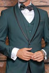 A person dressed in an Insomnia INSOMNIA SUNSET 3PC Slim Fit Hunter Tuxedo Suit with black lapels and a crisp white shirt underneath. As they adjust their cuffs, the stylish reversible vest beneath and the black bow tie complete this elegant ensemble perfectly.