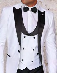 A person dressed in the INSOMNIA ROME white spandex tuxedo suit from Insomnia, featuring a slim fit design with a black lapel, paired with a black bow tie and double-breasted vest.