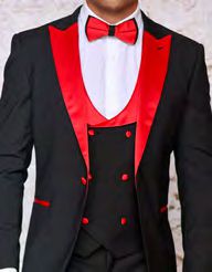 A person wearing the Insomnia ROME 3PC Slim Fit Black Red Spandex Tuxedo Suit, featuring a sleek design with striking red lapels and a matching red bow tie.