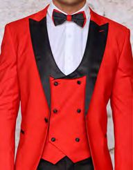 Wearing the INSOMNIA ROME 3PC Slim Fit Red Spandex Tuxedo Suit from Insomnia, a person embodies sophistication in its vibrant red hue with striking black lapels and a matching bow tie, beautifully offsetting a crisp white shirt.