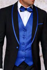 A man dressed in the INSOMNIA SUNSET 3PC Slim Fit Black Royal Tuxedo Suit by Insomnia, featuring blue satin lapels, a reversible vest in matching blue, a crisp white shirt, and a stylish blue bow tie.