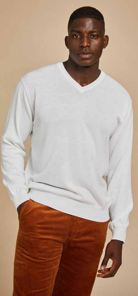 A person wearing the Inserch Cotton Blend V-Neck Sweater 4608 in white stands against a beige background, paired with brown corduroy pants.