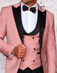 An individual gracefully donned an Insomnia INSOMNIA ROME 3PC Slim Fit Rose Gold Spandex Tuxedo Suit featuring black lapels and a chic bow tie.