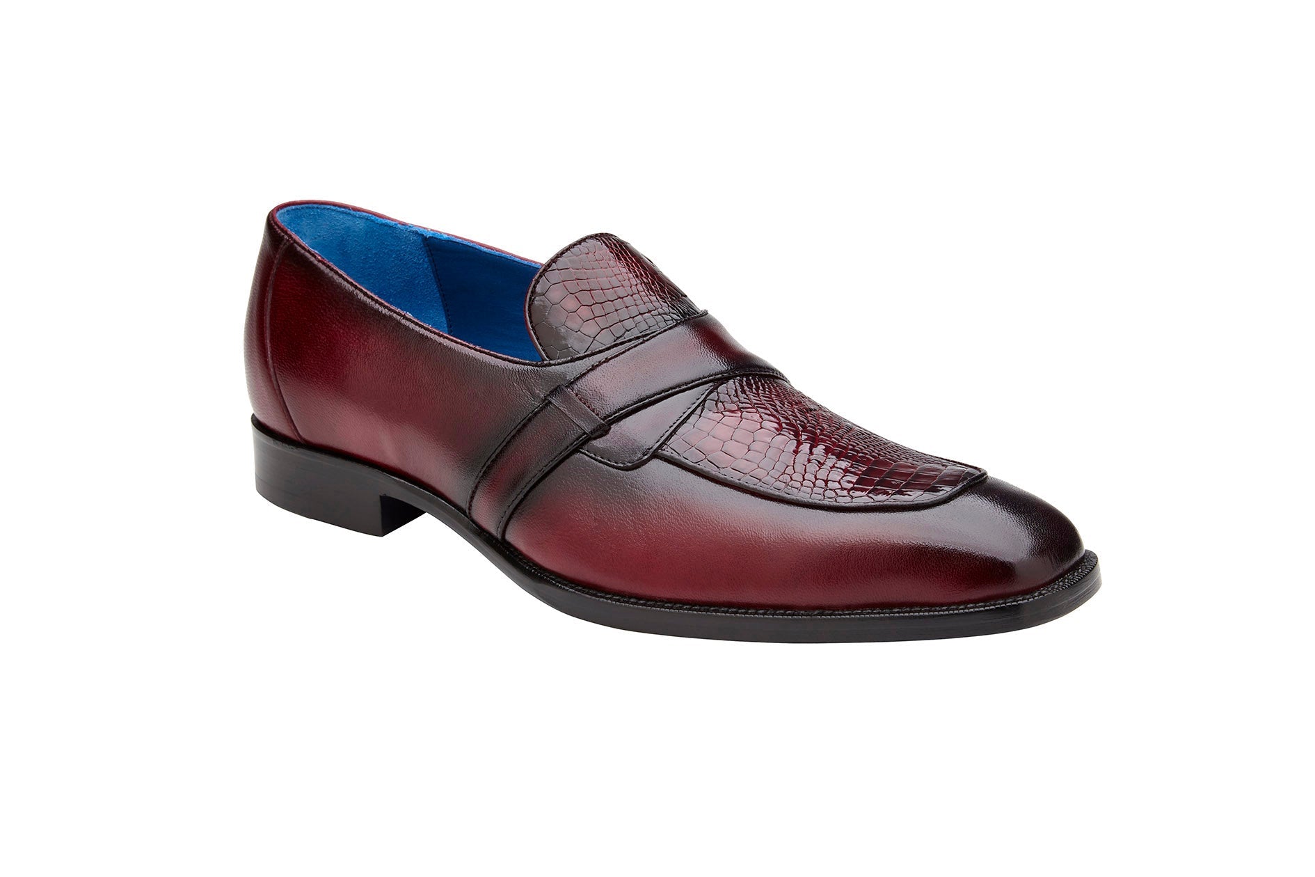 Displayed against a white background is the Belvedere - Tornado, Genuine American Alligator / Italian Calf Dress Shoe in Antique Burgundy by BELVEDERE. This slip-on loafer features a textured pattern on the top and a low heel.