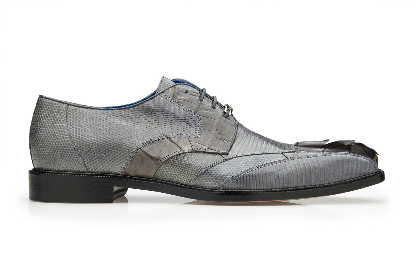 The Belvedere Valter is a Gray Genuine Caiman Crocodile and Lizard dress shoe with a textured pattern. It features a low heel, lace-up closure, and soft leather lining.