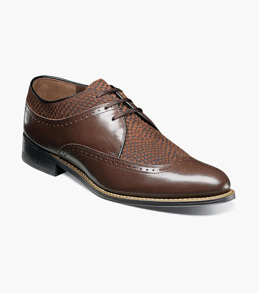 The Stacy Adams - DAYTON Python Print Wingtip Oxford in brown is exquisitely crafted with a perforated pattern and lace-up design, elegantly displayed on a white background.