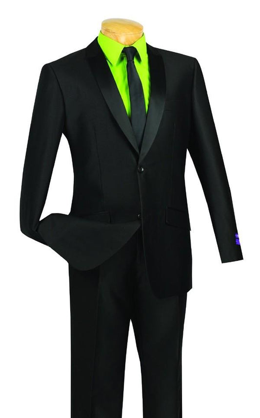 A mannequin showcases the Vinci Slim Fit Shiny Sharkskin 2 Piece Suit in black, featuring a modern slim fit with a satin lapel. This elegant Vinci Suits creation is stylishly paired with a bright green shirt and black tie, ideal for any sharp dresser seeking both elegance and practicality.