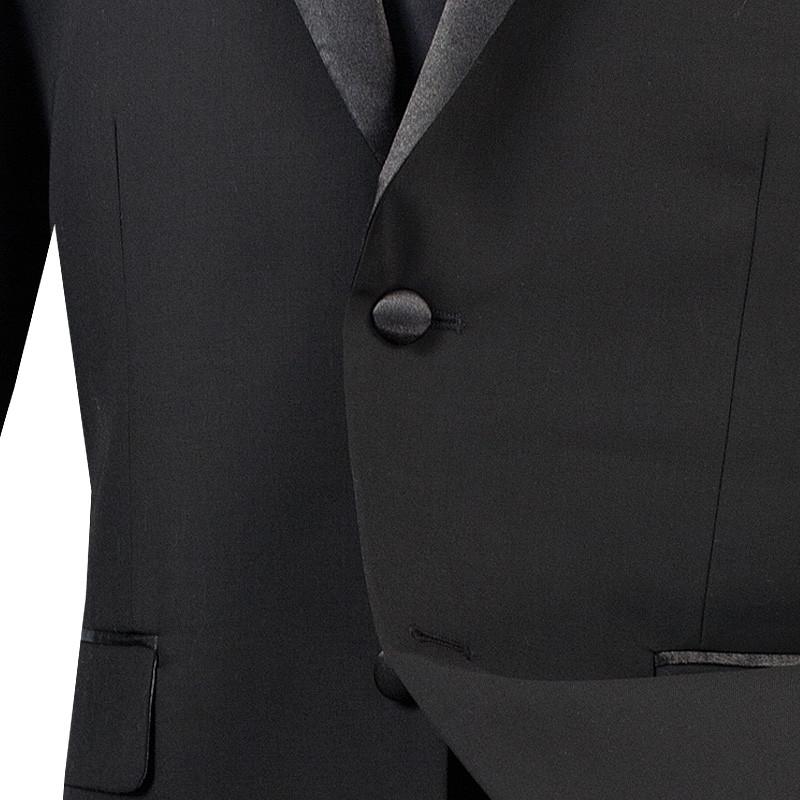 The mannequin is adorned with a stylish black Vinci Slim Fit 2 Piece 2 Buttons Design Tuxedo (T-SC900), featuring a satin shawl collar. Accompanied by a matching tie and a pristine white dress shirt, this elegant ensemble from Vinci Suits offers wrinkle resistance, ensuring you look flawless at any occasion.