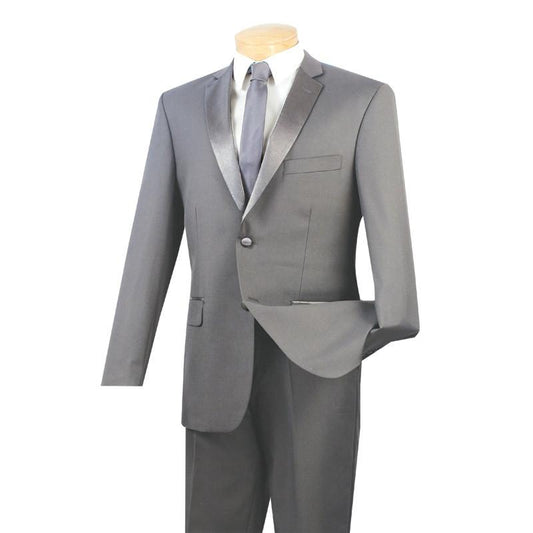 A mannequin displays the Vinci Suits Vinci Slim Fit 2 Piece 2 Buttons Design Tuxedo in gray, embodying refined elegance with its slim fit design. The suit jacket, paired with a matching tie and white shirt, features a notched lapel and is buttoned with one hand in the pocket.