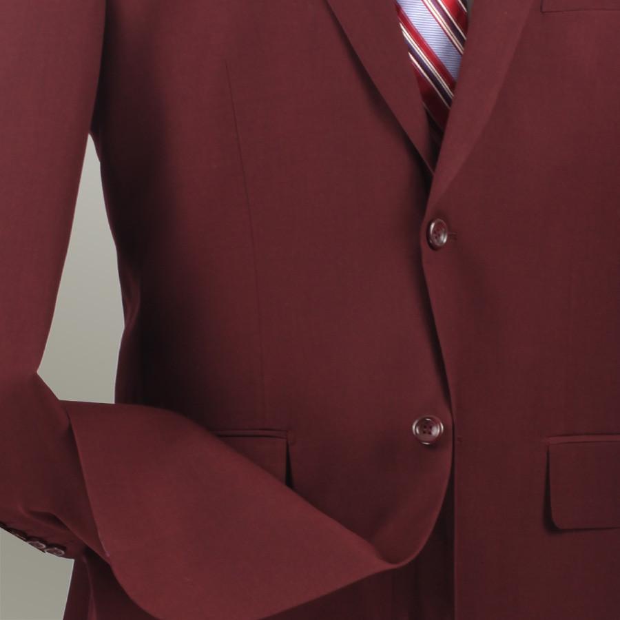 Displayed on the mannequin is the Vinci Regular Fit 2 Piece 2 Button Textured Weave Suit in burgundy, from Vinci Suits, featuring flat front pants. It's styled with a white shirt and a red, white, and blue striped tie.