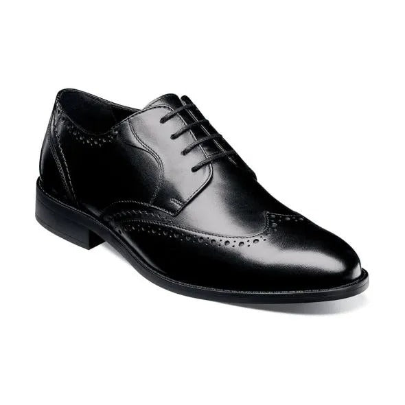 The Stacy Adams Barlow Wingtip Oxford in black, style number 20197-001, is crafted from burnished leather featuring brogue detailing and a lace-up design. It offers ultimate comfort with its Memory Foam footbed.