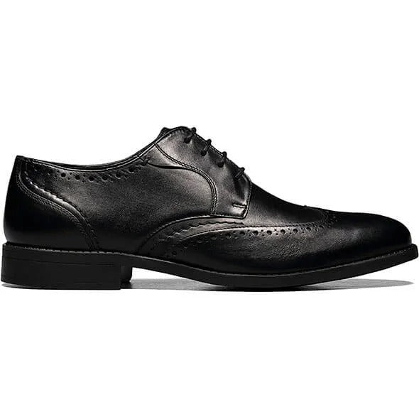 The Stacy Adams Barlow Wingtip Oxford in black, style number 20197-001, is crafted from burnished leather featuring brogue detailing and a lace-up design. It offers ultimate comfort with its Memory Foam footbed.