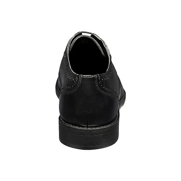 The Stacy Adams Barlow Wingtip Oxford in black, style number 20197-001, is crafted from burnished leather featuring brogue detailing and a lace-up design. It offers ultimate comfort with its Memory Foam footbed.