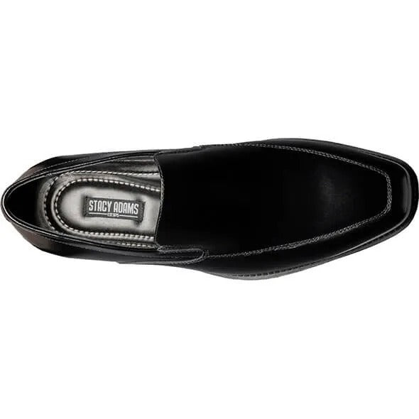 The Stacy Adams ALDRICH Moc Toe Slip On (style number 20193-001) features a sleek black leather upper and a cushioned insole, presented on a white background.