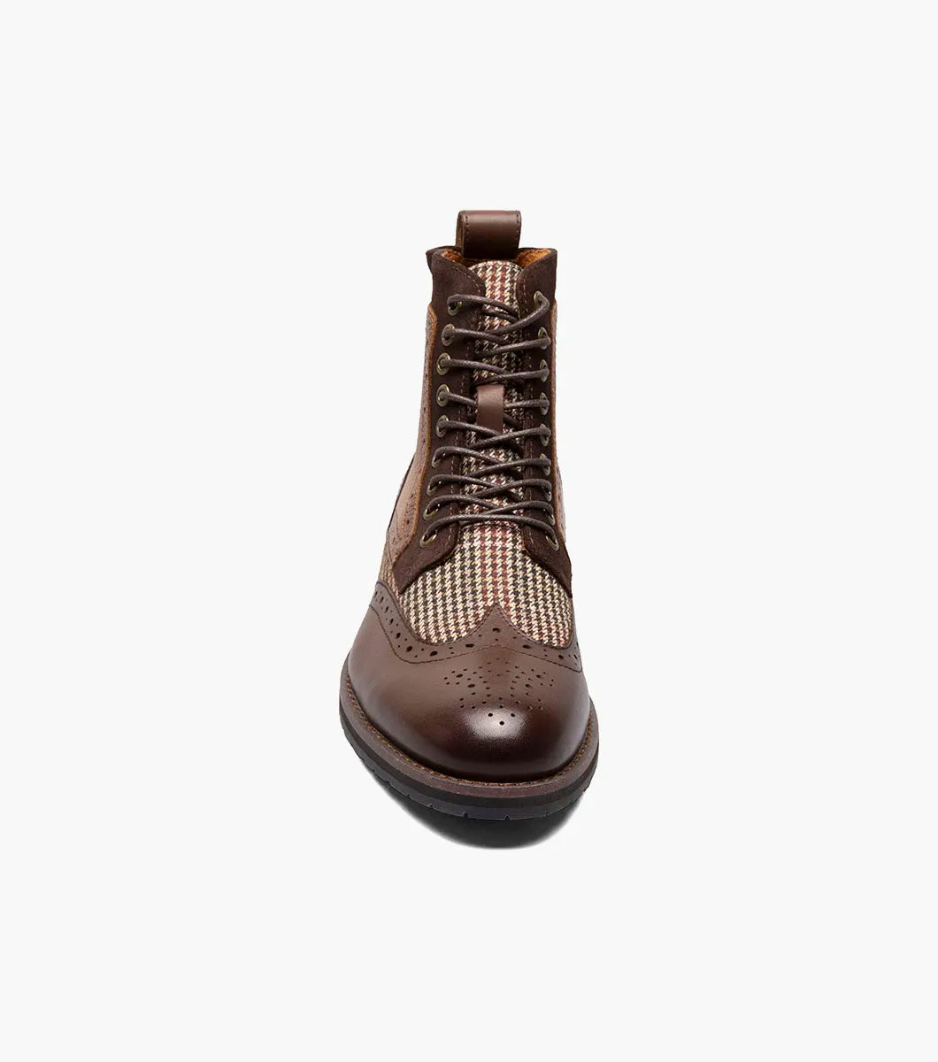 Introducing the Stacy Adams OSWYN Wingtip Lace Up Boot in Brown Multi. This stylish boot from STACY ADAMS features a combination of brown leather and tweed with intricate perforations, a mixed material upper, and a textured sole for unmatched comfort. Enhanced with a Memory Foam insole, these lace-ups provide superior cushioning and support for all-day wear. Product code: 25552-249.