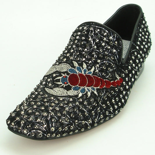 The FI-7252 Black Fiesso by Aurelio Garcia from Fiesso is a slip-on shoe featuring silver spikes and an embroidered red and blue scorpion design, adding an edgy touch to any outfit.