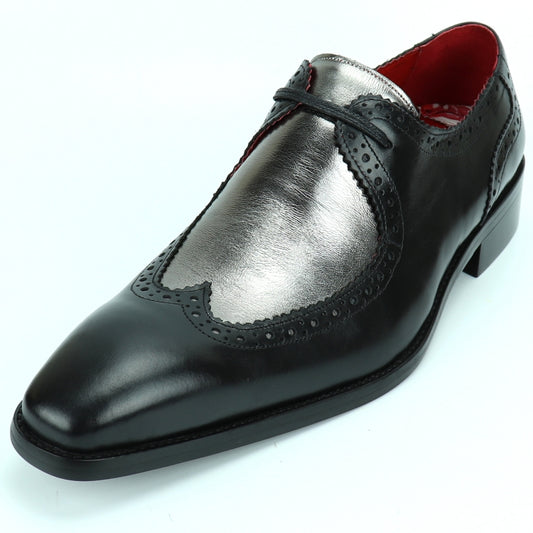 The FI-8704 Black Silver Encore by Fiesso boasts a sleek black leather design with metallic silver accents and decorative perforations, finished with a cushioned insole for enhanced comfort.