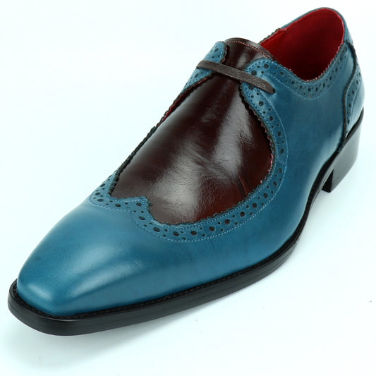 The FI-8704 Blue Burgundy Encore by Fiesso is a single fashion shoe with a leather upper that showcases a blue and brown design, intricate stitching, and a red interior. This striking piece from Fiesso is not only stylish but also features a cushioned insole for added comfort.