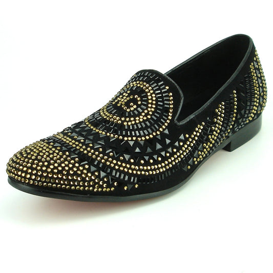 The FI-7220 Black Gold Fiesso by Aurelio Garcia black slip-on shoe features a suede upper adorned with gold and black studs arranged in bold geometric patterns, embodying the essence of a high-fashion shoe.