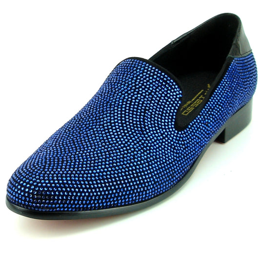 Introducing the FI-7285-A Black Blue Fiesso by Aurelio Garcia from the renowned brand Fiesso, this fashion-forward shoe boasts a vibrant blue suede upper adorned with delicate blue rhinestones. Enhanced with a sleek low black heel and sophisticated black trim, this slip-on epitomizes style and elegance.