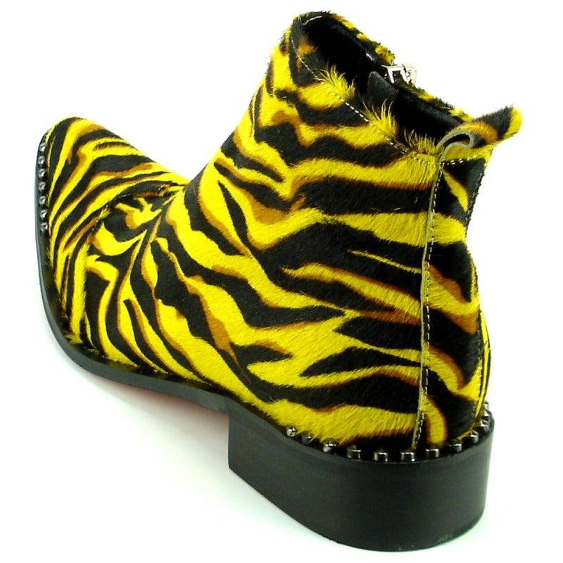 The FI-7315 Yellow Black Leopard Boot by Fiesso features a tiger-striped design in yellow and black, complemented by a pointed toe, studded sole, and cushioned insole for enhanced comfort.