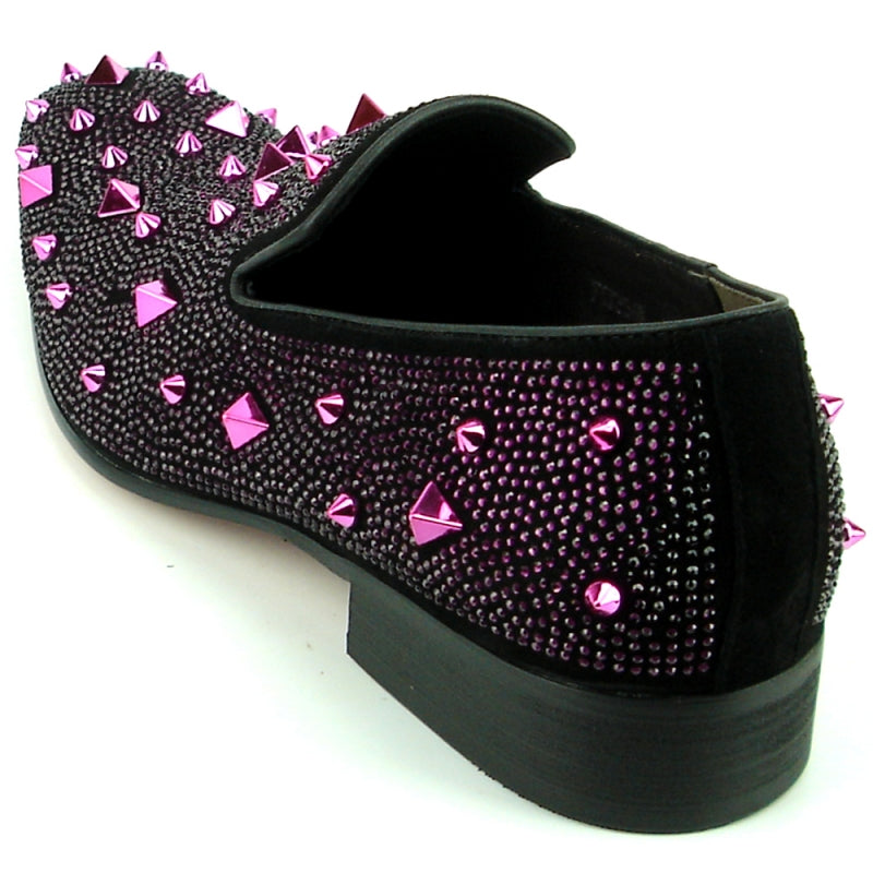 The FI-7364-R Black/Purple Fiesso by Aurelio Garcia from Fiesso is a stylish fashion shoe featuring a chic black suede upper adorned with shiny purple studs and spikes. It boasts a low heel and slip-on design for easy wear.