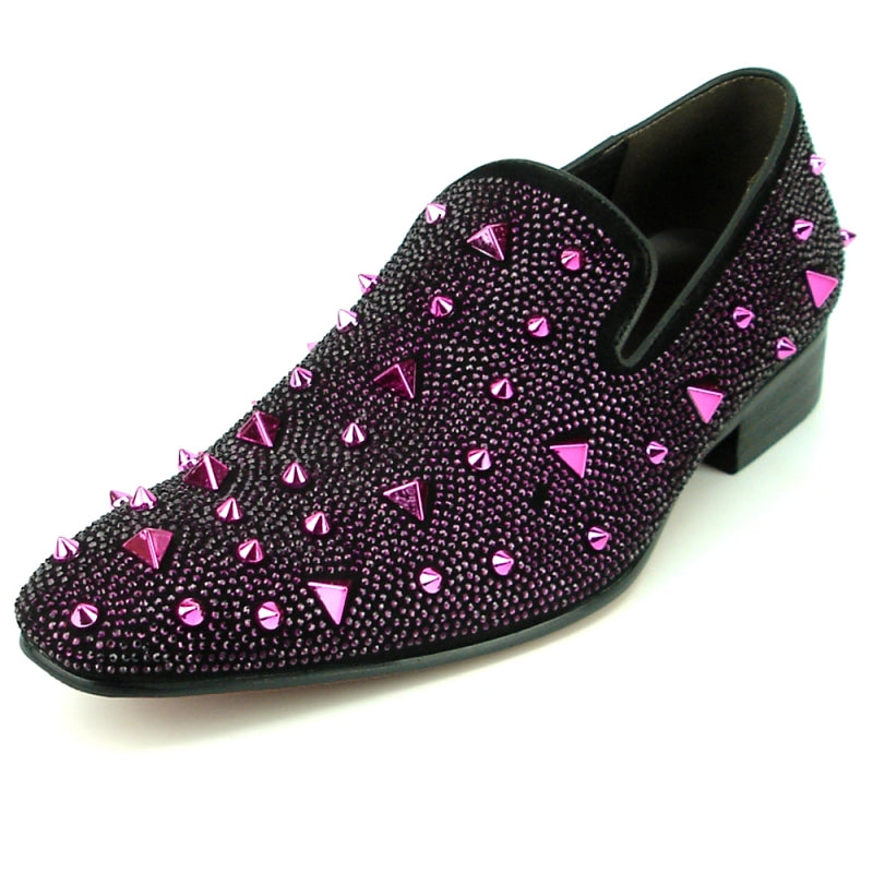 The FI-7364-R Black/Purple Fiesso by Aurelio Garcia from Fiesso is a stylish fashion shoe featuring a chic black suede upper adorned with shiny purple studs and spikes. It boasts a low heel and slip-on design for easy wear.