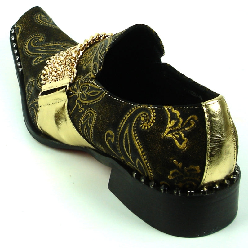 The FI-7322 Gold Chain Leather Shoes by Fiesso feature a black leather upper adorned with elegant gold paisley patterns, a metallic gold buckle, chain decoration, and a sleek pointed toe that completes the low-heel design.