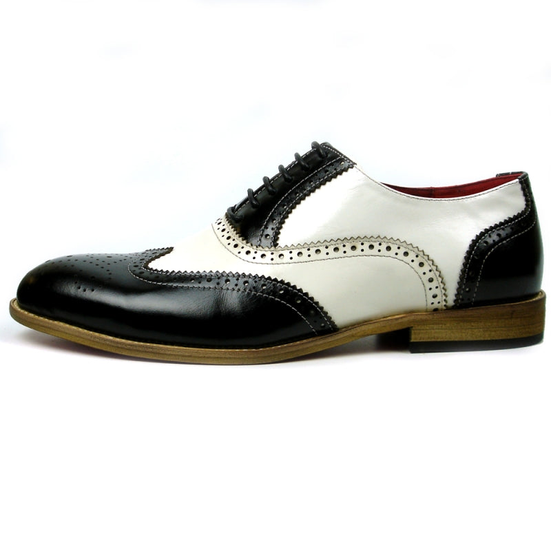 Fiesso introduces the FI-7400 Black White Wing Tip Lace Up by Aurelio Garcia, a striking fashion shoe with a leather upper adorned with intricate perforations and enhanced by a chic brown sole, all highlighted against a plain white background.