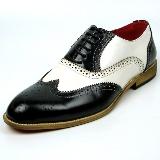 Fiesso introduces the FI-7400 Black White Wing Tip Lace Up by Aurelio Garcia, a striking fashion shoe with a leather upper adorned with intricate perforations and enhanced by a chic brown sole, all highlighted against a plain white background.