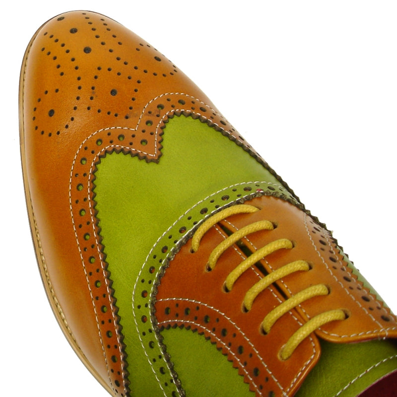 The FI-7400 Tan Green Wing Tip Lace Up by Fiesso showcases a leather upper adorned with brown and green panels, intricate decorative perforations, and sophisticated brown laces.