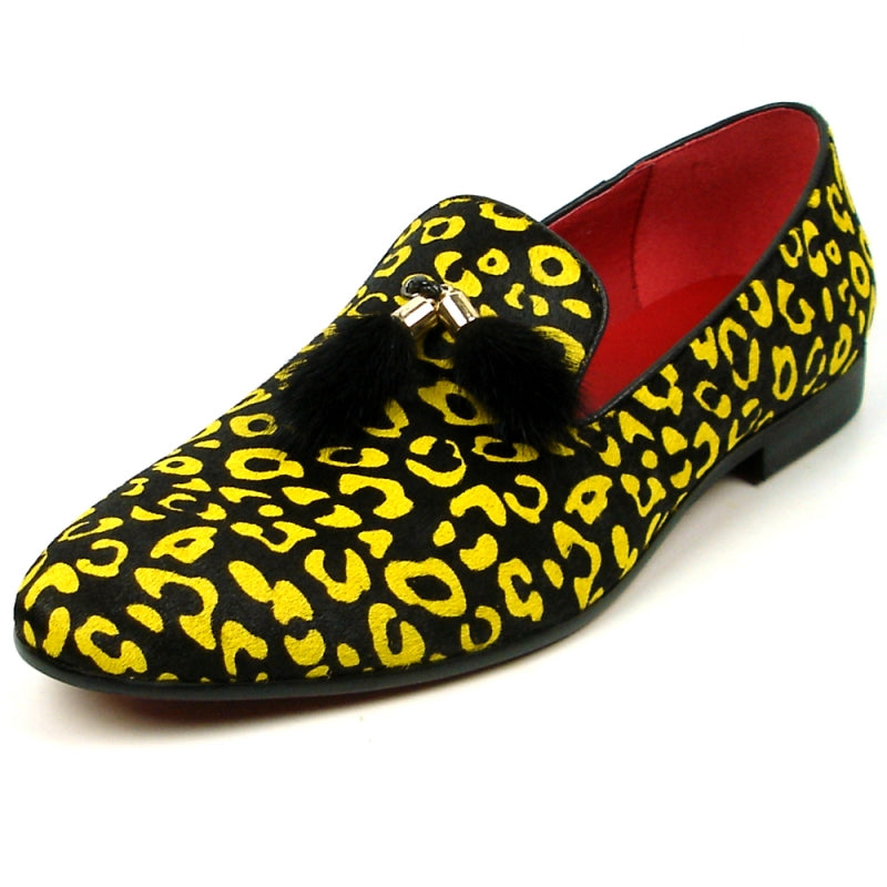 The FI-7402 Black Yellow Leopard Fiesso by Aurelio Garcia loafer from Fiesso showcases a leather upper in a striking yellow and black leopard print, complemented by a red interior and adorned with black tassels on top.