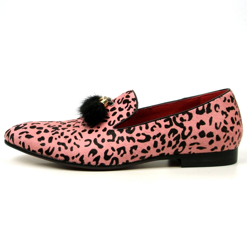 The FI-7402 Black Pink Leopard Fiesso by Aurelio Garcia, from the brand Fiesso, is a striking loafer featuring a pink leopard print with black tassels and a vibrant red interior. Designed as a slip-on leather fashion shoe, it offers ultimate comfort with its cushioned insole while making a bold statement that seamlessly blends style and practicality.