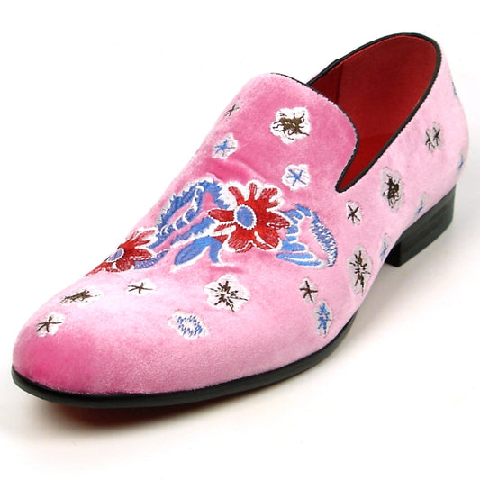 The FI-7413 Pink Flower Slip on Fiesso by Aurelio Garcia from brand Fiesso features a pink velvet upper adorned with vibrant floral embroidery in red, blue, and white patterns, complete with a sleek black heel.