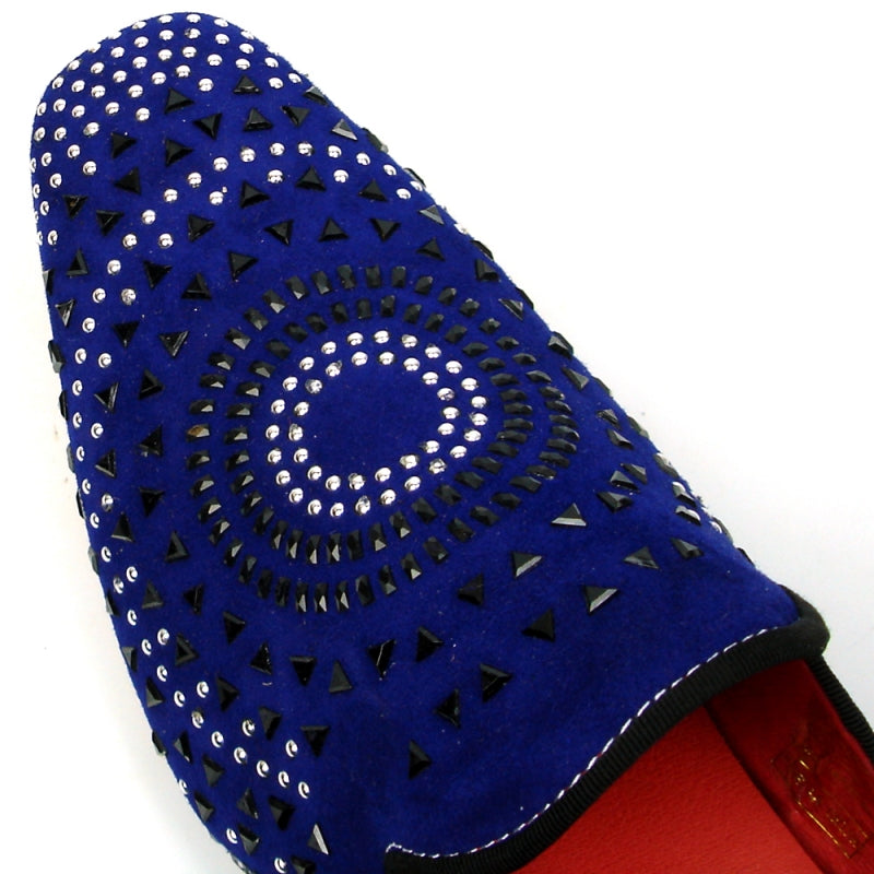 The FI-7420 Blue Suede Fiesso by Aurelio Garcia fashion shoe is a blue slip-on with a suede upper, embellished with an eye-catching concentric pattern of black and silver studs on the exterior, and showcasing a bold red interior.