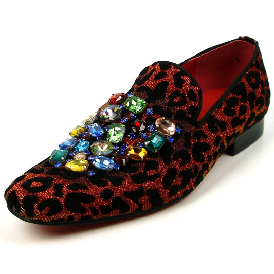 The FI-7422 Leopard Slip on Fiesso by Aurelio Garcia from the brand Fiesso showcases a striking red and black leopard print pattern, adorned with multicolored gem embellishments at the top. Its velvet upper exudes luxury, while the cushioned insole guarantees comfort with every step.