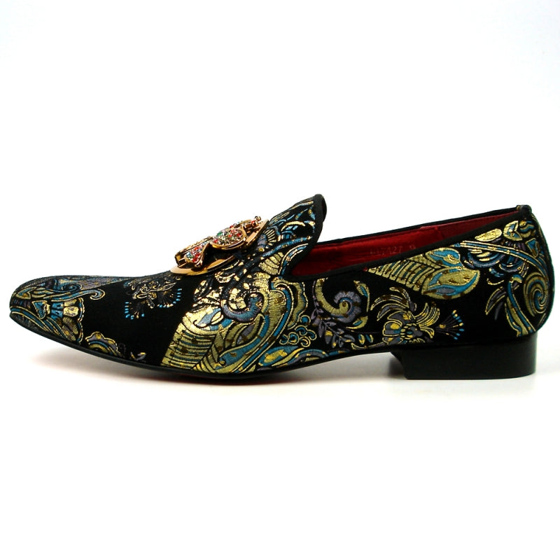 The Fiesso shoe by Aurelio Garcia, known as the FI-7427 Blue Slip on Butterfly, features a striking design with an ornate butterfly embellishment and colorful gemstones adorning its leather upper.