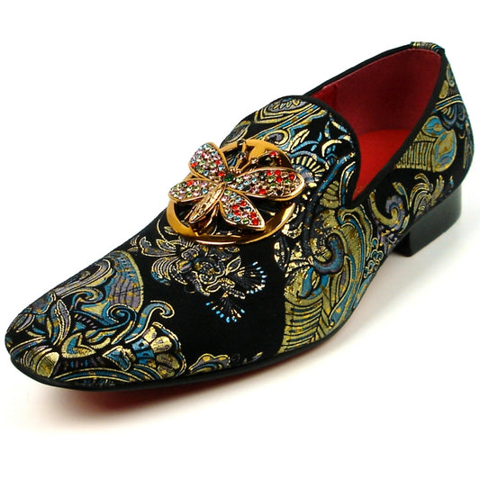 The Fiesso shoe by Aurelio Garcia, known as the FI-7427 Blue Slip on Butterfly, features a striking design with an ornate butterfly embellishment and colorful gemstones adorning its leather upper.