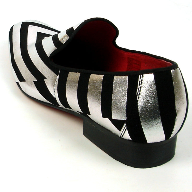 Introducing the FI-7429 Black Silver Stripes Fiesso by Aurelio Garcia, a stylish fashion shoe from Fiesso. This piece showcases a sleek black and silver striped design, complemented by a striking red interior and a comfortable low heel. Its premium leather upper and cushioned insole provide both elegance and support for ultimate comfort.