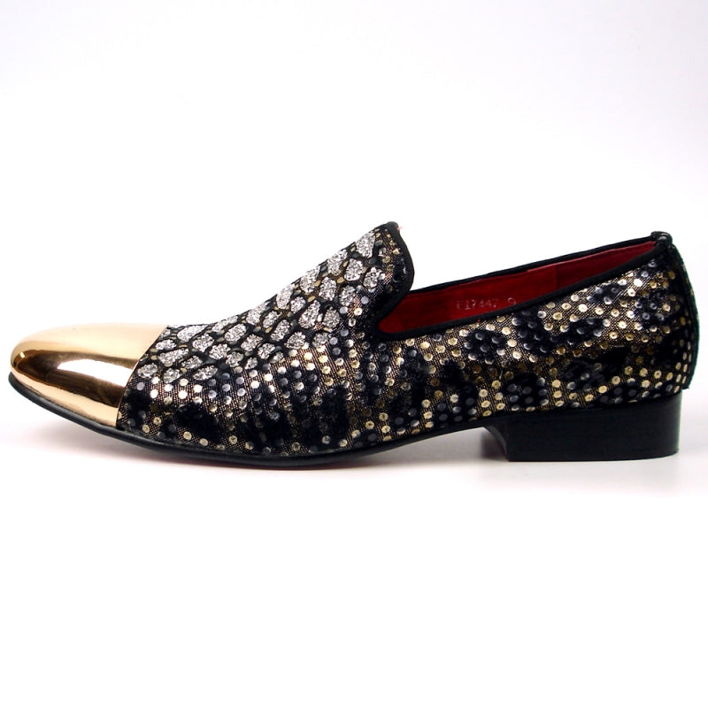 The FI-7447 fashion shoe by Fiesso boasts a black slip-on style featuring a gold metallic toe and a glittery, patterned leather upper, offering a stylish option from Aurelio Garcia.