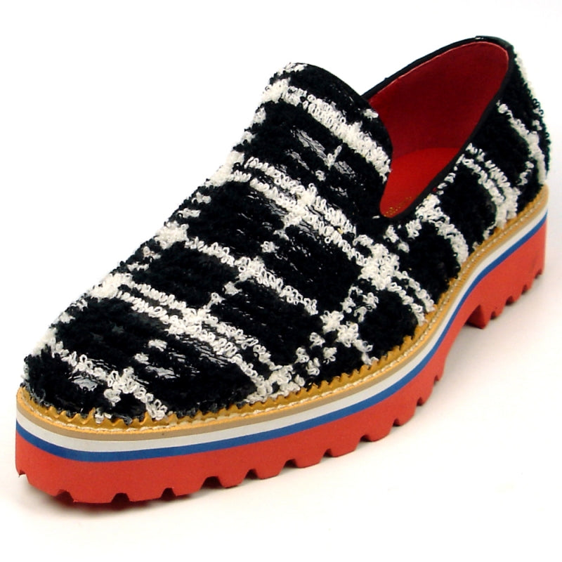 Introducing the FI-7452 Black Slip On by Fiesso, crafted by Aurelio Garcia, this stylish shoe showcases a striking black and white checkered fabric design with a vibrant red interior. It features a thick sole in bold shades of red, white, and blue. This comfortable slip-on design also includes a cushioned insole for enhanced comfort with every step.