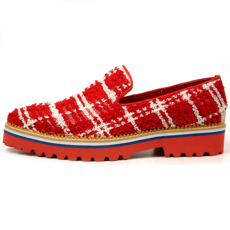 The FI-7452 Red Slip-On Fiesso by Aurelio Garcia is a fashion shoe that showcases a red and white plaid texture, complemented by a chunky red sole, blue trim, and leather upper.