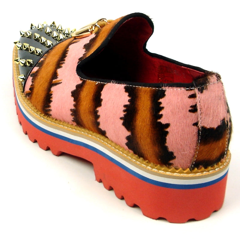 The FI-7455 Pink Slip on Fiesso by Aurelio Garcia showcases a vibrant design with a thick red sole, blending black, brown, and pink patterns. It is adorned with striking gold spikes and features a distinctive gold triangular embellishment.