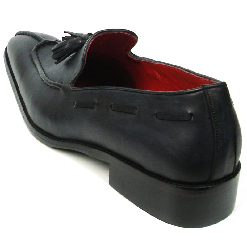 The FI-8701 Black Encore by Fiesso is a sophisticated leather loafer featuring elegant tassels, a luxurious red interior, and a low heel, perfect for those who appreciate high fashion shoes with timeless sophistication.