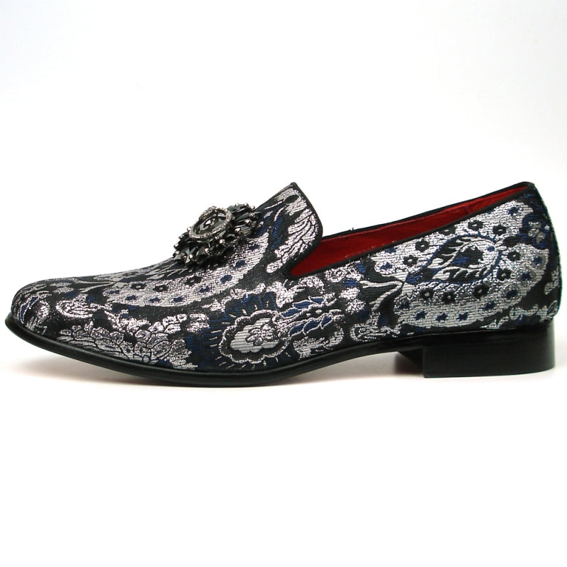 The FI-7385-3 Multi Color Slip-on by Fiesso features a stunning black and silver brocade design with a decorative gemstone embellishment on top and includes a cushioned insole for enhanced comfort.