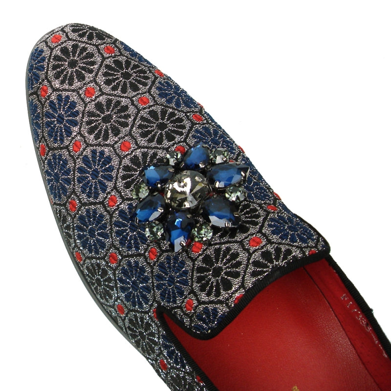 Introducing the FI-7385-4 Blue Multi Color Slip-on by Fiesso: a stylish decorative shoe embellished with a floral pattern and glittering blue and black gemstones on the upper, featuring a red interior lining and a cushioned insole for optimal comfort.