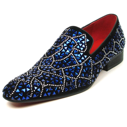 The FI-7415 Black Suede Blue Stone shoe by Fiesso boasts a black slip-on design adorned with a geometric pattern of blue and silver embellishments and is highlighted by a vibrant red interior lining.