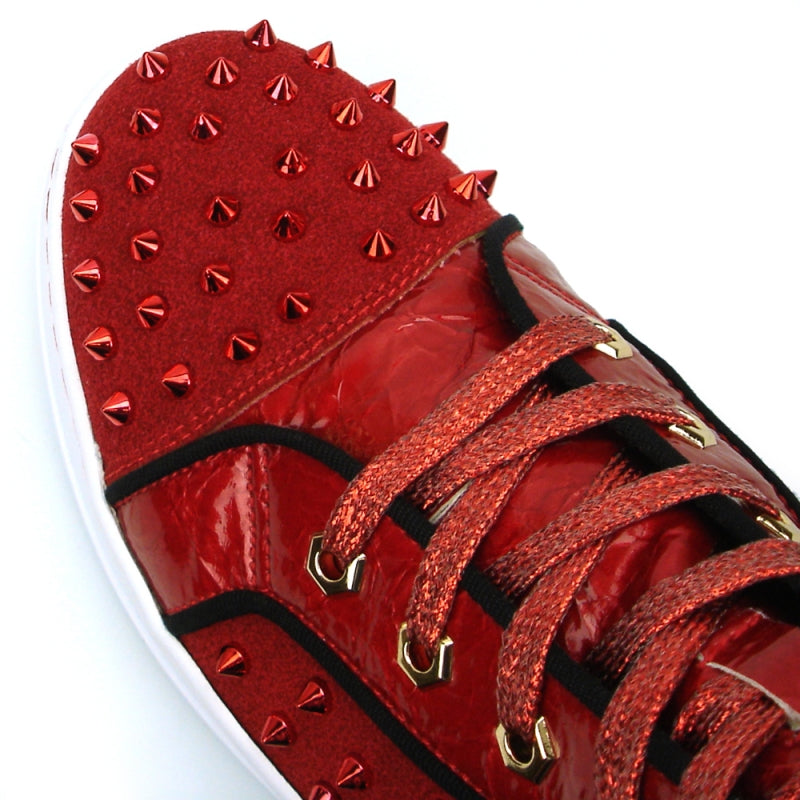 Introducing the FI-2364 Red High Top Sneaker Encore by Fiesso—this striking red high-top shoe features a glossy leather finish adorned with metal spikes on the toe and sides. Enhanced with red laces, a white sole, and decorative stitching, it seamlessly combines leather and suede for added sophistication.