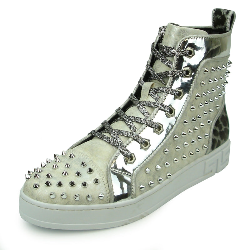 The FI-2364 Silver High Top Sneaker Encore by Fiesso showcases a sleek metallic finish, complete with spikes and a robust white sole. Luxurious leather accents enhance its modern design edge, making it a standout piece from the Fiesso brand.